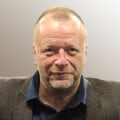 Headshot of man wearing shirt and jacket