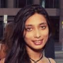 Headshot of woman with long dark hair in casual attire