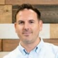 Headshot of man wearing shirt indoors