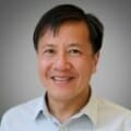 Headshot of man wearing shirt indoors