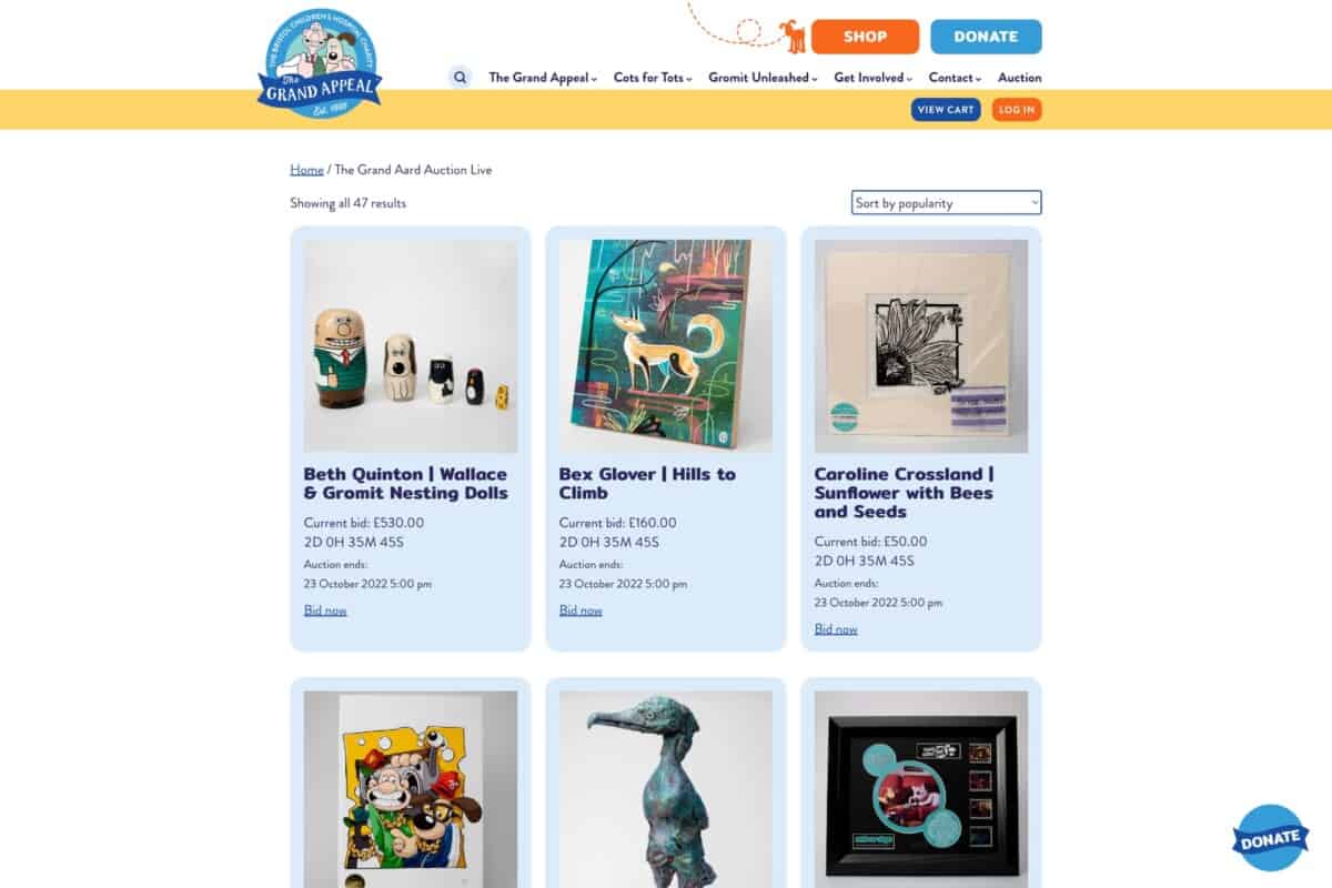 Screenshot of The Grand Appeal's WordPress and WooCommerce site showing charity auction to support Giving Tuesday blog post