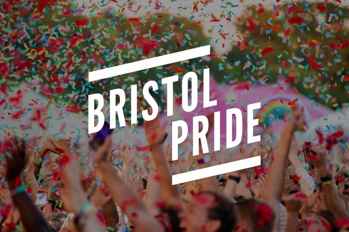 Bristol Pride logo in front of picture of attendees celebrating