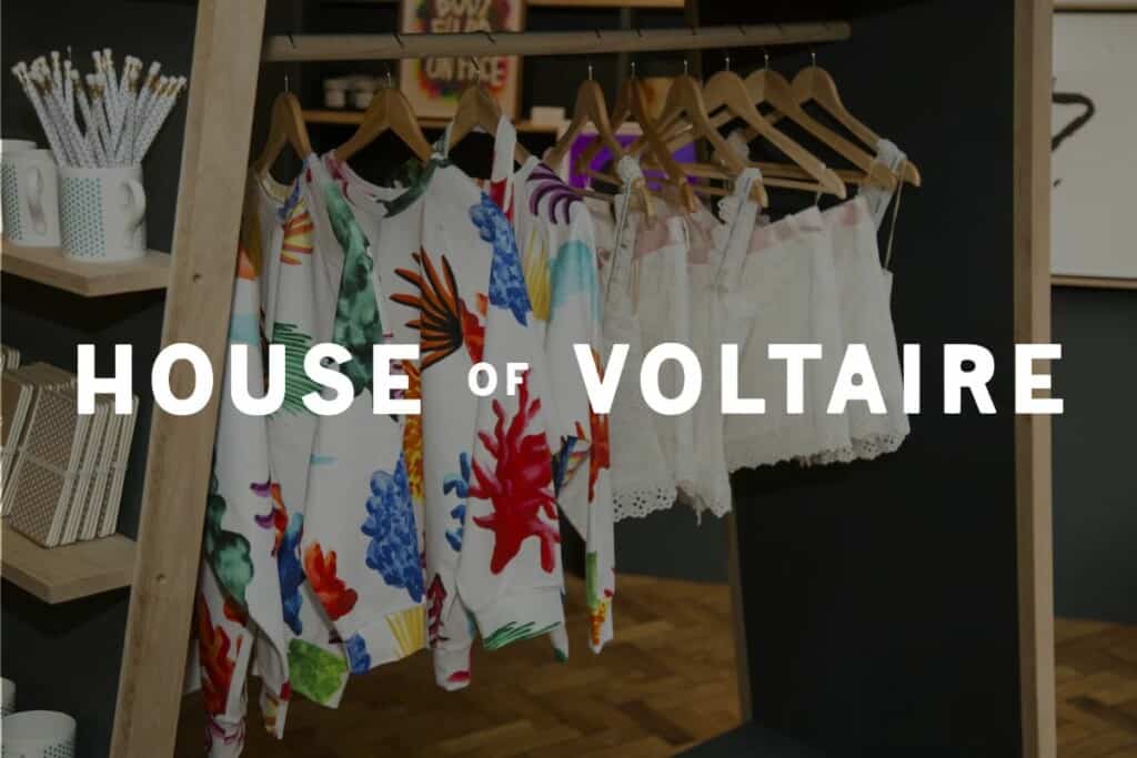 House of Voltaire logo in front of image of the products from their Shopify store