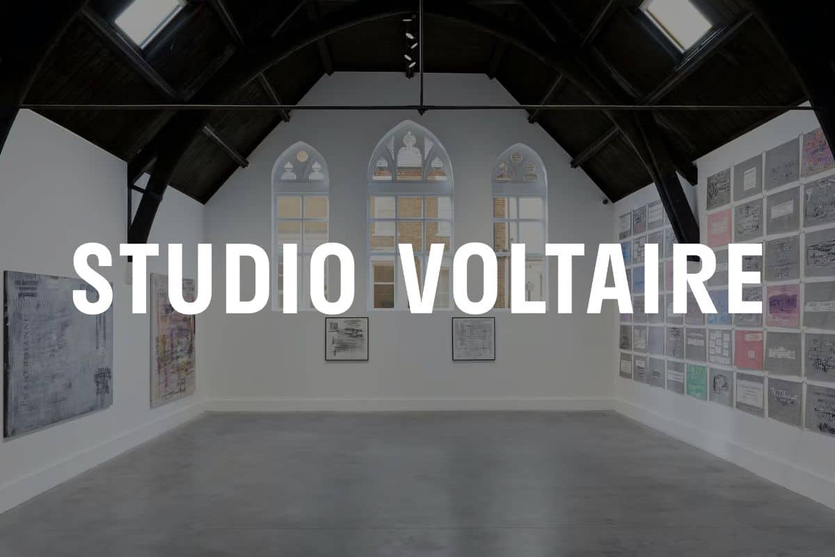 Studio Voltaire logo in front of image of the gallery