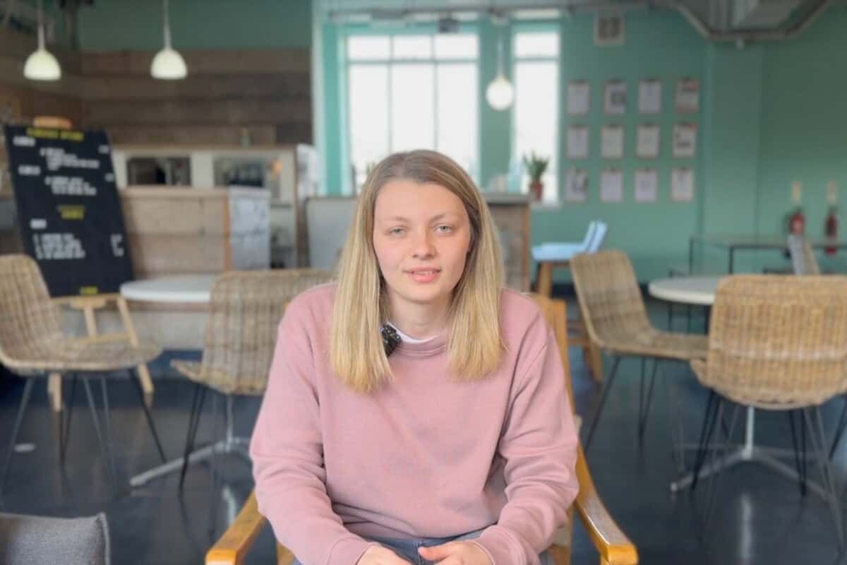 Client Partner, Nat, in communal office space
