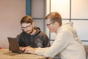 Ollie and Jamie in team meeting