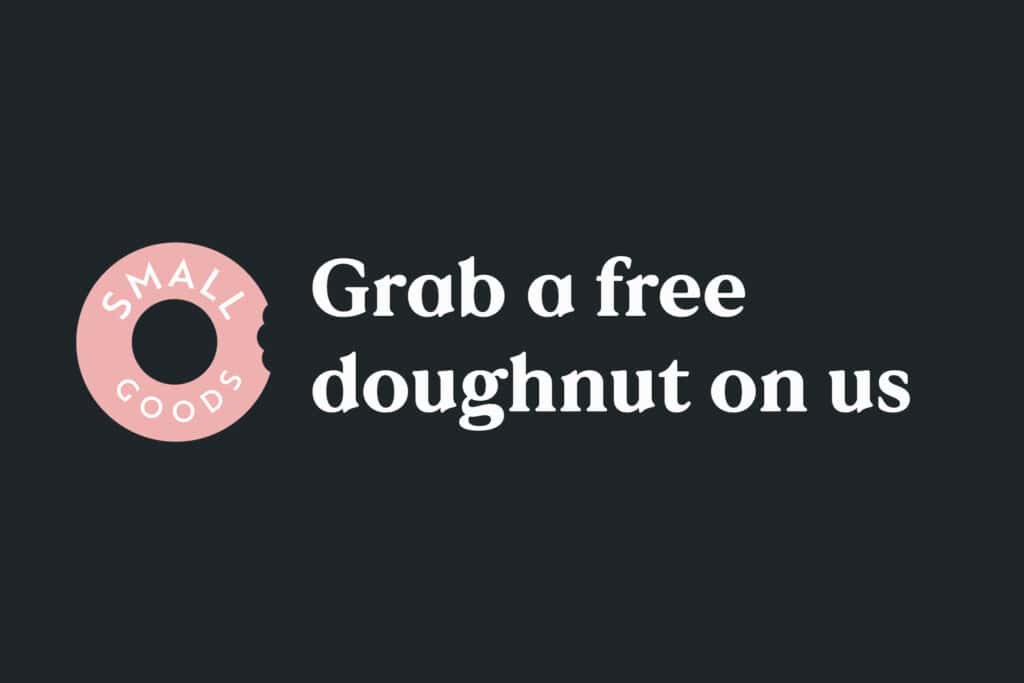 Pink donut with Small Goods logo beside text saying "Grab a free doughnut on us"